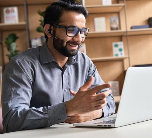 Professional man on video call discussing marketing strategy online