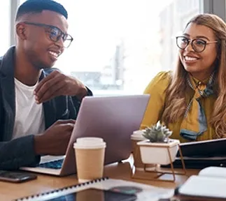 Two marketing professionals collaborating on growth strategy at desk
