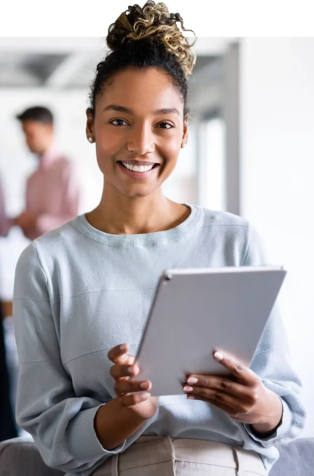 Smiling professional woman holding tablet